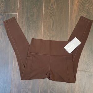 BNWT Athleta Salutation Stash 7/8 Tight (XS) in Brown